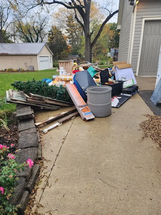 Dumpster being loaded with debris for 3 Yard Dumpster Rental in Phoenix